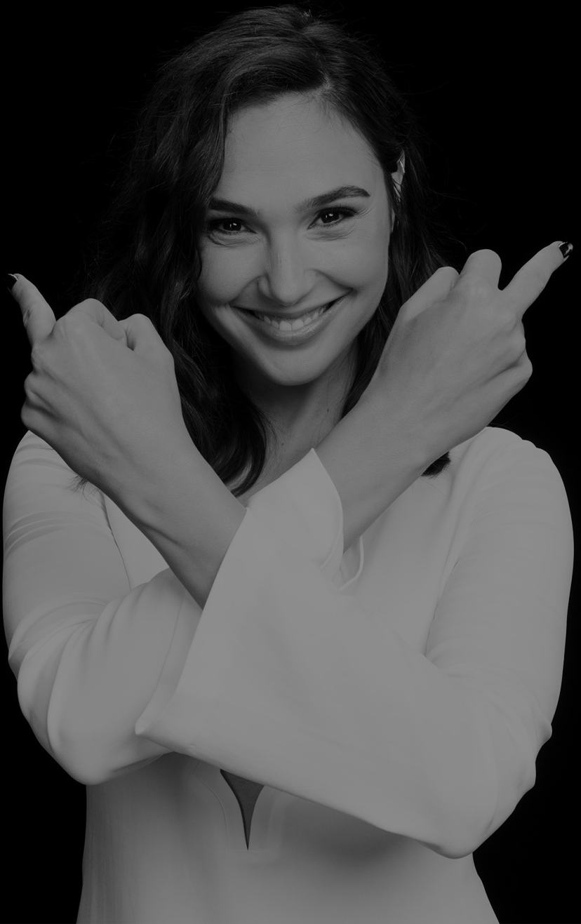 Gal Gadot showing both middle fingers while laughing (black & white image)
